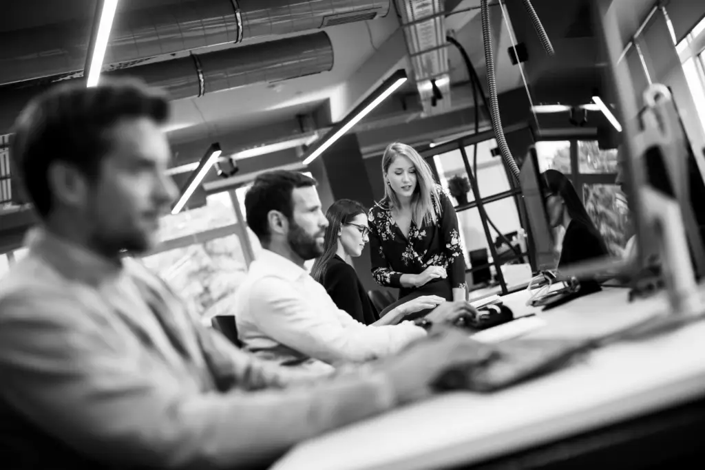 Business people in the office representing The Essential Guide to Purchasing News Data